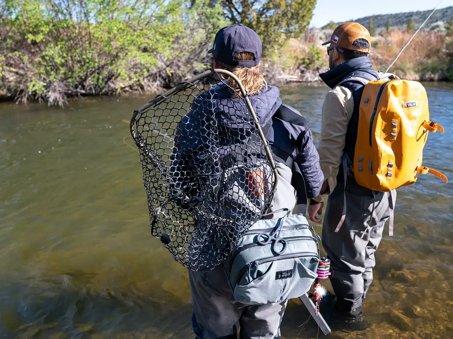 Anglers wading a clear freestone river near Dubois, Wyoming